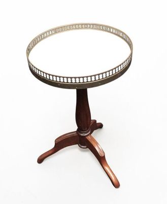 an image of a round table with a wooden base and a glass top