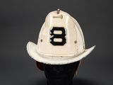 a white fireman ' s hat with the number 8 on it