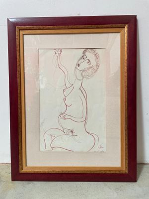 framed drawing of a woman sitting on her knees with her hand up in the air