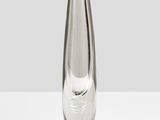 a glass vase that is sitting on a table