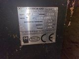 a close up of a metal sign on a wall