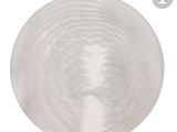 a white plate with a circular design on it