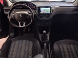 the interior of a small car with a steering wheel and dashboard