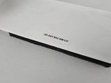 a piece of paper that has a sticker on it