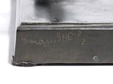 a close up of a piece of metal with writing on it
