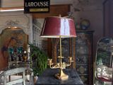 a table with a lamp on top of it in a room