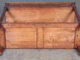 an old wooden trunk with wheels on the floor