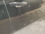 a close up of a car door handle and door handle