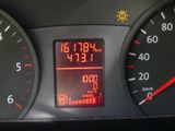 a close up of a car ' s dashboard with a digital clock