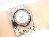 a woman ' s wrist that has a watch on it