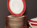 several plates and bowls are stacked on top of each other on a table