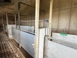 a long row of stalls inside of a building