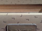 an image of a handbag with a name tag on it
