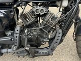 a close up of a motorcycle engine on the ground