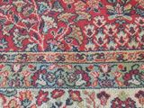 an oriental rug with a red and blue design on it