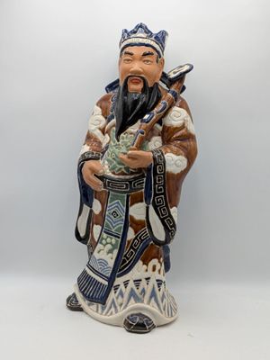 an image of a figurine of a man holding a bag of money