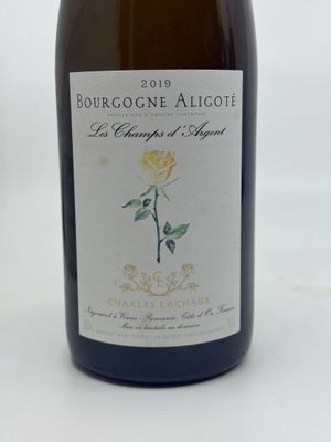 a bottle of wine that is sitting on a table