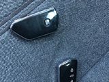 a close up of a button on a car ' s seat