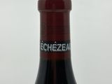 a bottle of wine that is sitting on a table