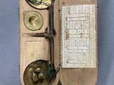 a small wooden box with a compass on top of it