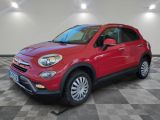 a red fiat suv parked in a garage with checkered floor