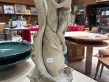 a statue that is sitting on a table in a store