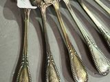 a lot of spoons that are sitting on a table