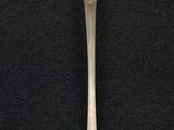 silver spoon on a black background with a silver spoon in the middle of the spoon