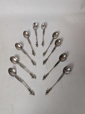 a lot of spoons in the shape of a christmas tree