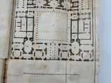 an old book with a drawing of a building on it