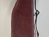 a brown case sitting on a white surface