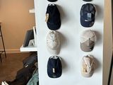 many hats hanging on the wall in the room