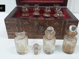 a wooden box with glass bottles and a wooden box with glass bottles