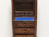 an image of a small wooden cabinet with a blue top