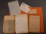 an old book with a bunch of writing on it sitting on top of a table