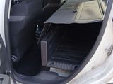 a car with the door open and the floor mat in the back