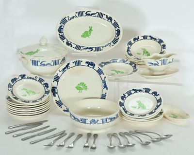 a lot of dishes and spoons that are on the table