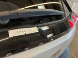 a car with a sticker on the back of it ' s trunk