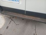 a car with a license plate on the side of it
