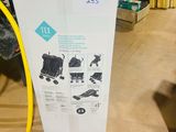 a box that has a baby stroller inside of it
