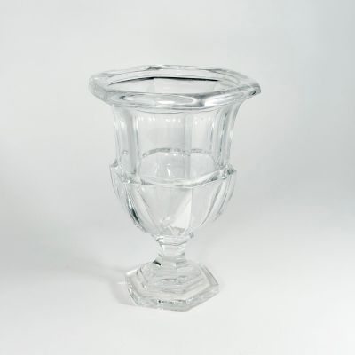 clear glass vase sitting on top of a white surface