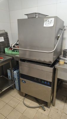 a large commercial fryer sitting in the middle of a kitchen