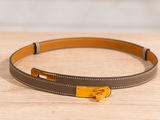 a close up of a belt on a wooden surface
