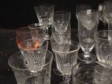 a lot of glasses that are sitting on a table