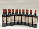 six bottles of red wine are lined up in a row