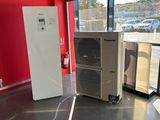 an image of a room with a refrigerator and a refrigerator freezer
