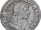 a silver coin with an image of a man on it