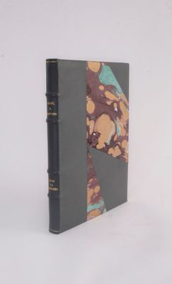 a book that is sitting on a white surface