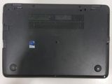 a black laptop that has a blue sticker on it