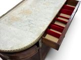 a marble top desk with a drawer underneath it